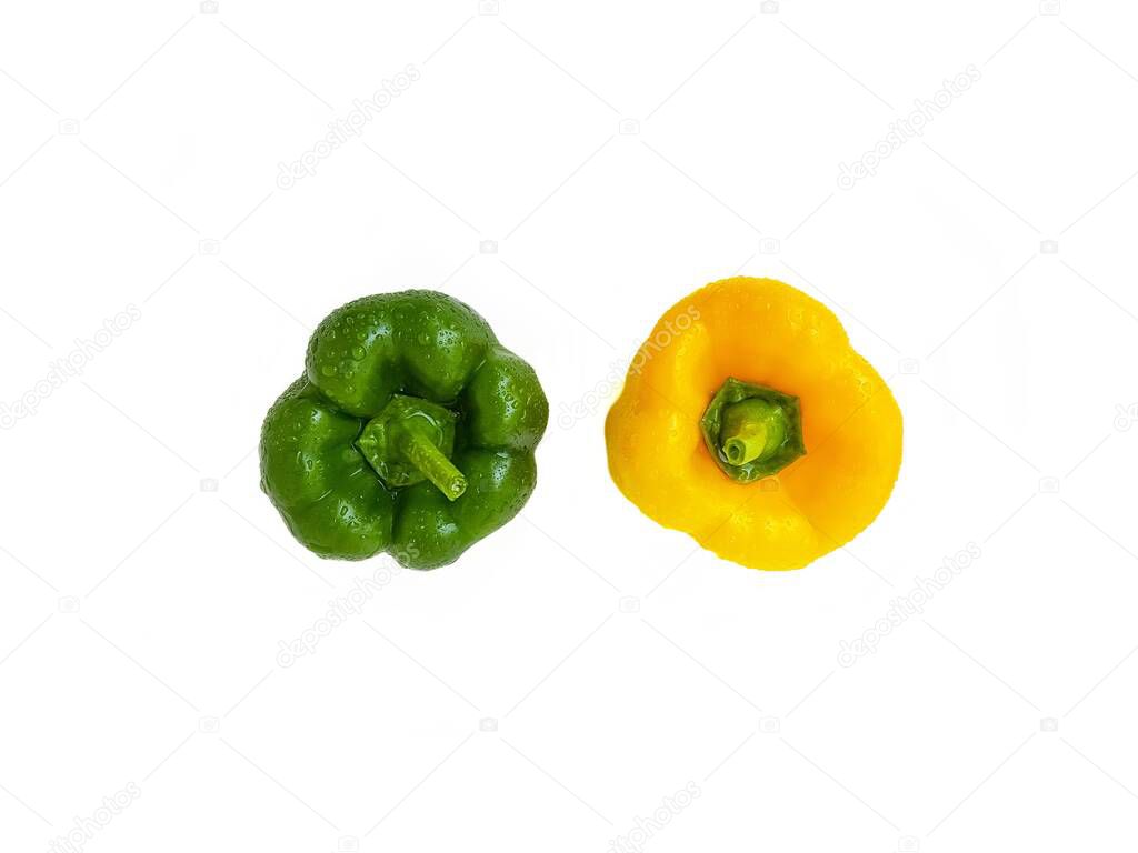 Green and yellow bell pepper on a white background. The concept of a healthy diet.
