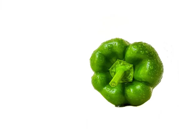 Green bell pepper on a white background. The concept of a healthy diet. — Stock Photo, Image