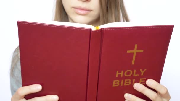 Young Handsome Woman Reads Holy Bible — Stock Video