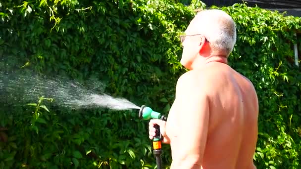 Elderly Man Waters Plants House Watering Spray — Stock Video