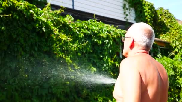 Elderly Man Waters Plants His House Watering Spray — Stock Video