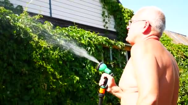 Elderly Man Holds Watering Spray Waters Plants House — Stock Video