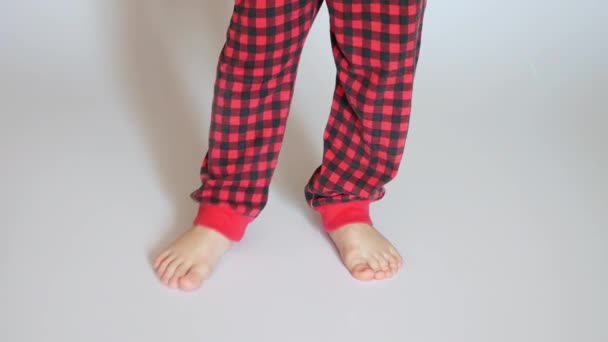 Little Boy Wearing Red Plaid Pants Stomps His Foot Standing — Stock Video