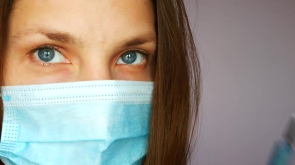 Close Young Lady Protective Mask Holding Syringe Blue Liquid Shoots — Stock Video