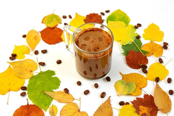Autumn flat composition coffee Cup with a wreath of brightly colored dry leaves and coffee beans lying on a white background. Creative autumn, thanksgiving, Halloween concept. Top view, copy space