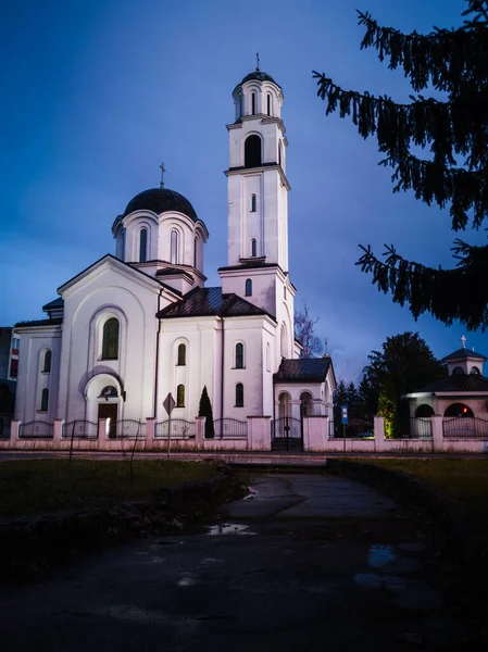 Religious building, Orthodox church dedicated to the Protection of the Holy Virgin with ominous, dark storm clouds in the background. Brod, Bosnia and Herzegovina.