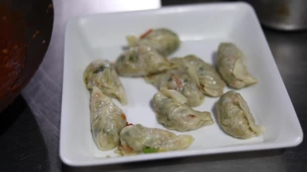 Pouring Red Chilly Gravy Chicken Momos Dim Sum — Stock Video