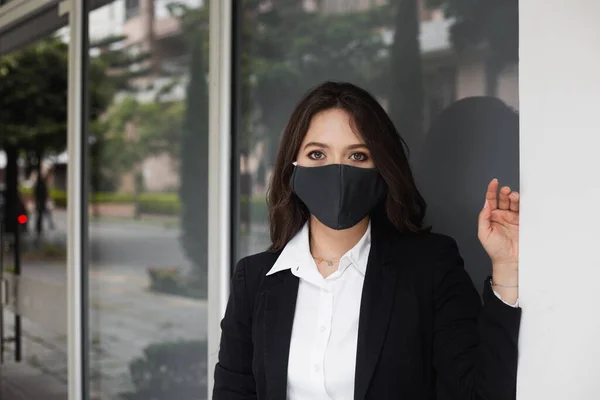 business woman with face mask waiting to go to work