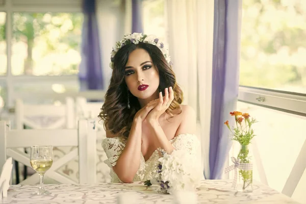 Woman or bride in wreath on long hair in restaurant — Stock Photo, Image