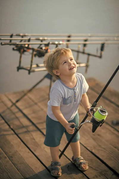 Little boy learn to catch fish in lake or river — Stock Photo, Image