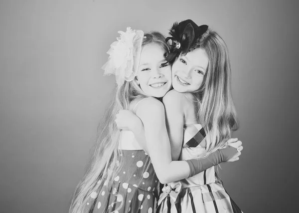 Little girls in fashionable dress, prom. little girls sisters embrace — Stock Photo, Image