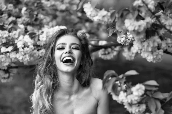 Happy woman in blossom — Stock Photo, Image