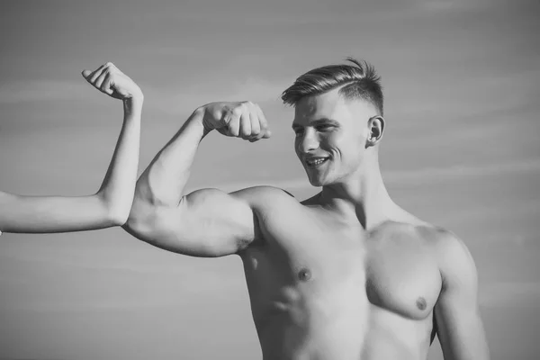 Mens heals body care. Man with strong hand biceps, triceps smile at female hand — Stock Photo, Image