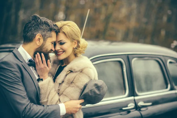 retro look of couple in love. retro car and happy couple in love outdoor
