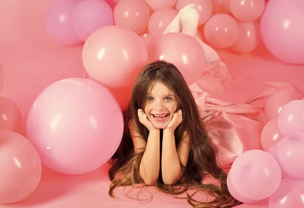 Kids playing with toys. Cute little girl in pink balloon — Stock Photo, Image