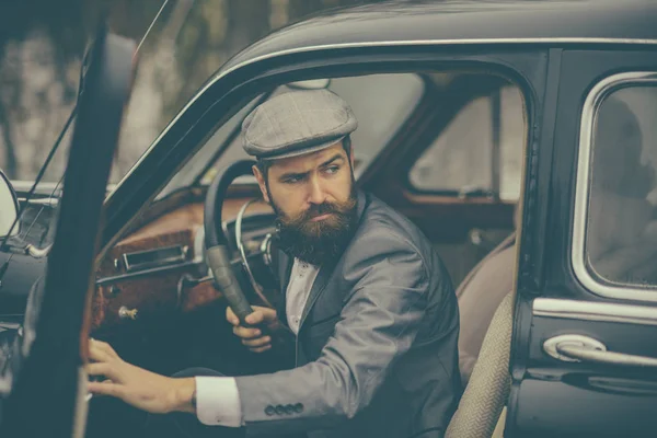 Escort man or security guard. escort service of bearded man in retro car