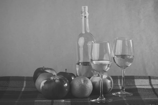 Bottle of wine two glasses and fruits — Stock Photo, Image