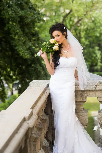 Fashionable White Gown Beautiful Blonde Model Bride Hairstyle And Makeup  Concept Slim Young Woman In Cute Wedding Dress Standing Indoors On Light  Background Attractive Girl Posing Near Curtains Stock Photo - Download