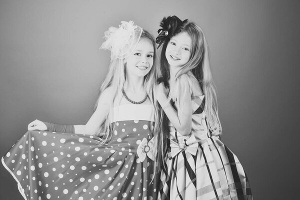 Fashion young kid model fece close up. Face female kid wiht happy emotion. Fashion and beauty, little princess. Friendship, look, hairdresser, wedding. Family fashion model sisters, beauty