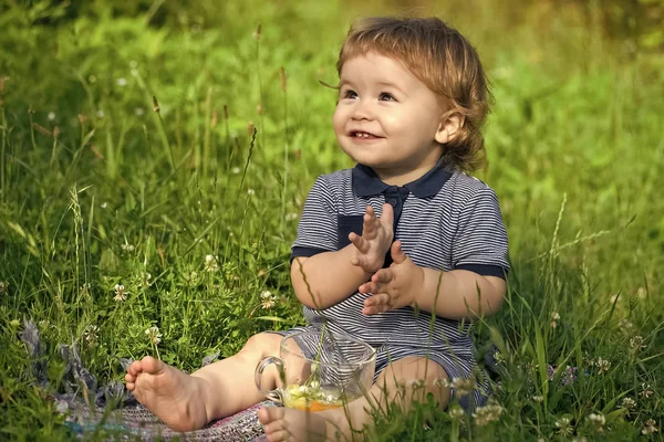Playful baby boy on grass — Stock Photo, Image