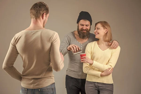 Sex drugs and rock and roll. Alcohol. Youth alcohol addicted. Guys hold cup, flask with alcohol, speak. Company of cheerful friends spend leisure with drinks. Communication, friendship, fun. Fun and — Stock Photo, Image