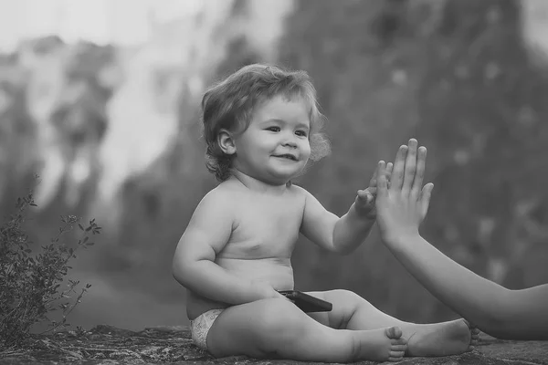 Childhood. Baby playing with mobile phone — Stock Photo, Image