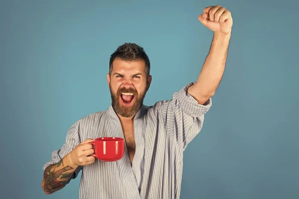 Fashion model Man fece close up. Face Man wiht happy emotion. Bearded hipster with red milk cup. — Stock Photo, Image