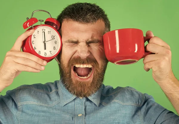 Handsome man face. Red mug with alarm, perfect morning.