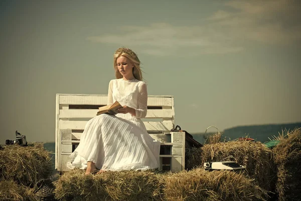 Women face skin care. Portrait women face in your advertisnent. Girl in straw wreath and white dress on sunny day