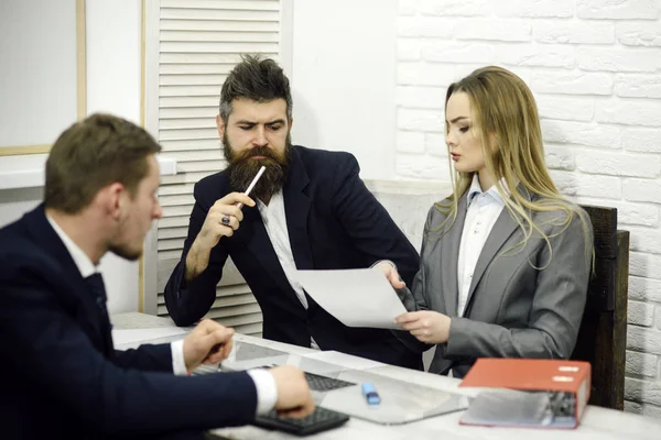 Business negotiations, discuss working tasks. Lady manager tries to organize working process with colleagues in office. Office atmosphere concept. Business colleagues at meeting, office background
