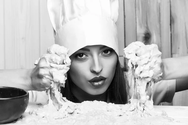 Female cook in kitchen