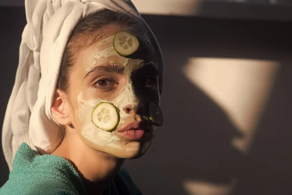 Cucumber mask. Girl or woman face with cucumber mask, towel on head — Stock Photo, Image