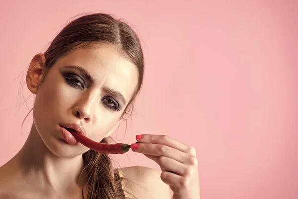 Girl with spice fruit and serious face. Health, diet concept, copy space Nutrition healthy lifestyle — Stock Photo, Image