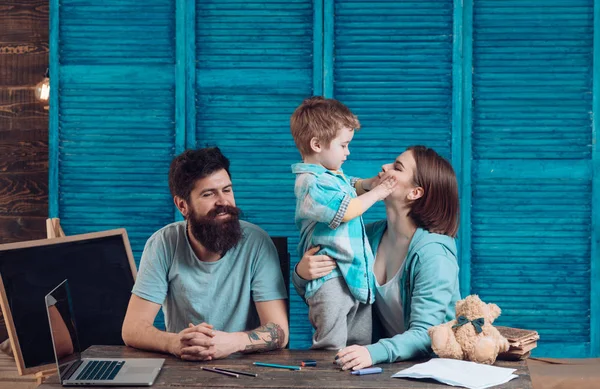 Family cares about education of their son. Parents teaches son, chalkboard on background. Homeschooling concept. Parents teaching kid, speaking. Boy listening to mom and dad with attention — Stock Photo, Image