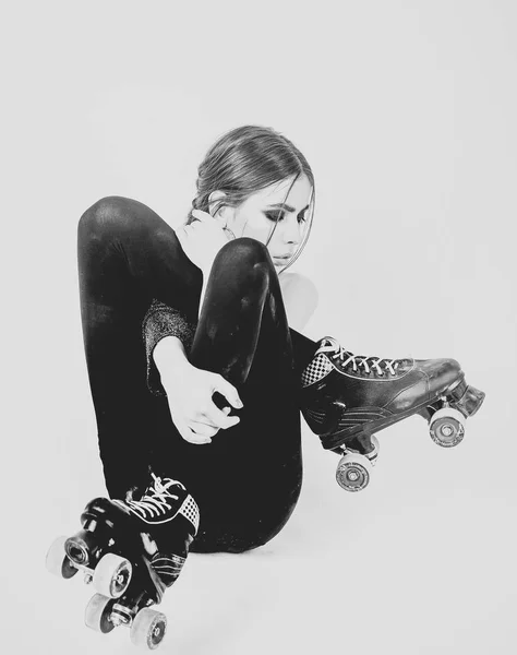 roller party. Girl with roller skates shoes on legs