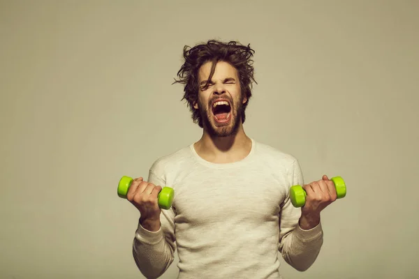 Morning workout. sleepy man with barbell doing morning exercise, has uncombed hair — Stock Photo, Image