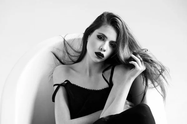 Fashion portrait of a girl in the bathroom. woman in dress with long hair, black lipstick in bath — Stock Photo, Image