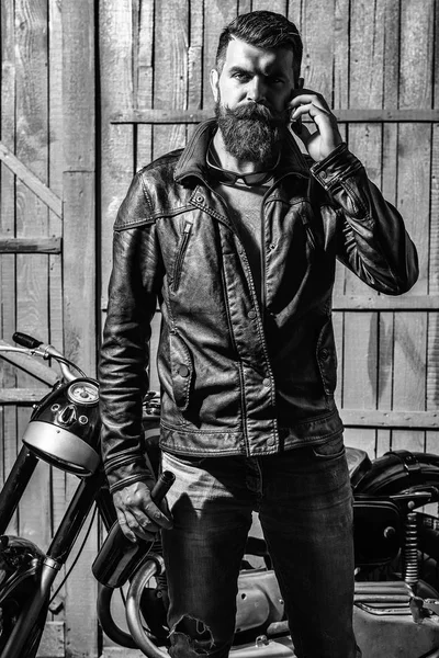 Brutal biker. Bearded man hipster biker — Stock Photo, Image
