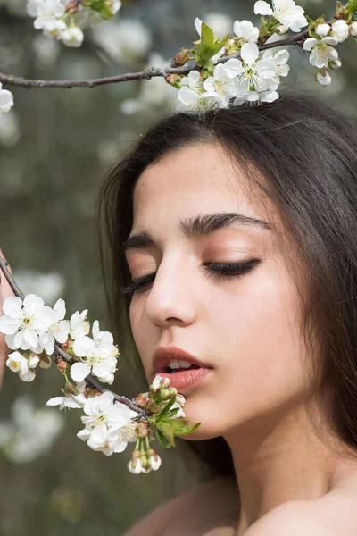 Beautiful as flower. Arabian woman enjoy flower blossom. Sensual woman with natural beauty look. Skincare and freshness. Spring mood. Womens day or 8 march — Stock Photo, Image
