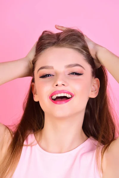 Beauty and hairdresser salon. Fashion look concept. Sexy woman with long hair on pink background. girl with makeup and healthy hair. Makeup for sensual model with soft skin. Feeling flirty. — Stock Photo, Image