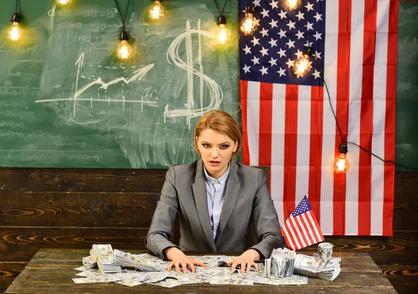 Economy and finance. economy of america with woman holding money at flag.