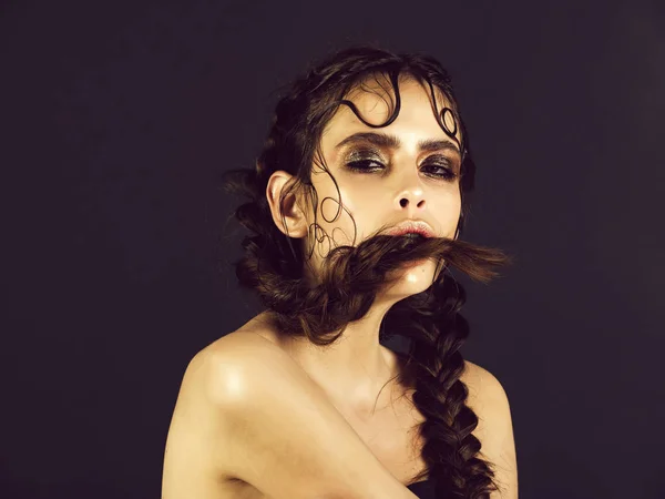 Beauty and hairdressing. girl holding braid in mouth — Stock Photo, Image