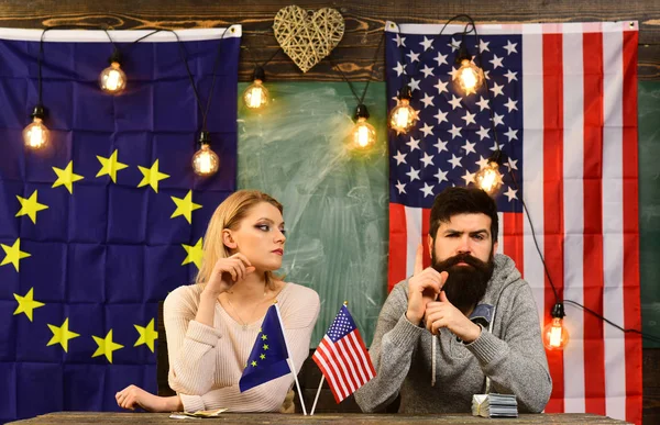 Economic partnership and finance. Partnership between usa and european union. bearded man and woman politician at conference. contract negotiation and business regulation. foreign policy conflict