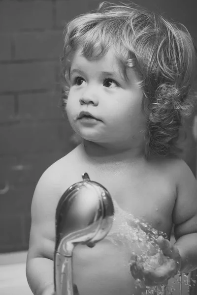 Child is washing. Baby boy in shower — Stockfoto