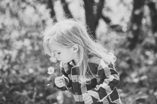 Child enjoys summer. Kid with long blond hair in plaid shirt outdoor — Stock Photo, Image