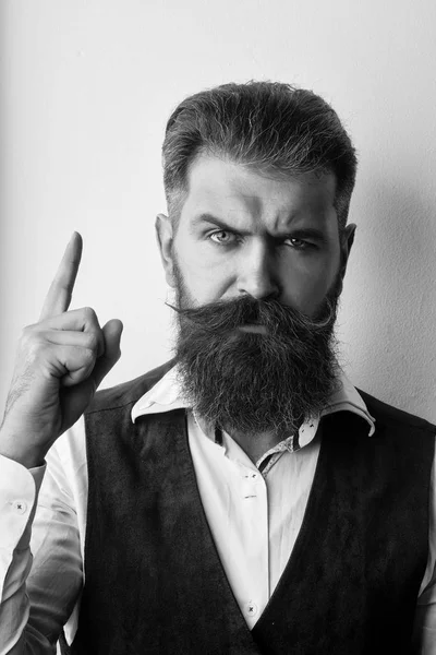 Bearded man points. bearded man, brutal caucasian hipster with serious face — Stock Photo, Image