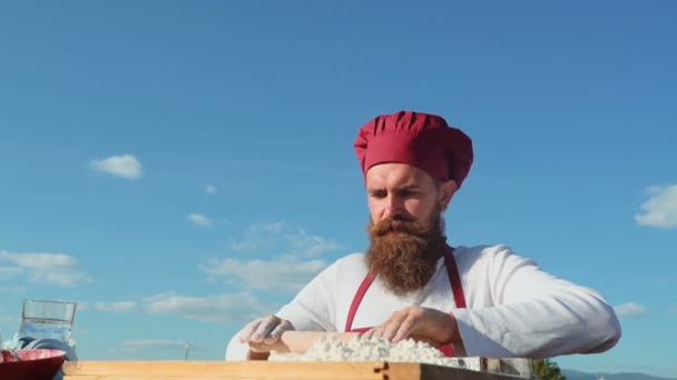 Bearded chef cooking on fresh air. Baker baking bread . Baker kneading the dough — Stock Video
