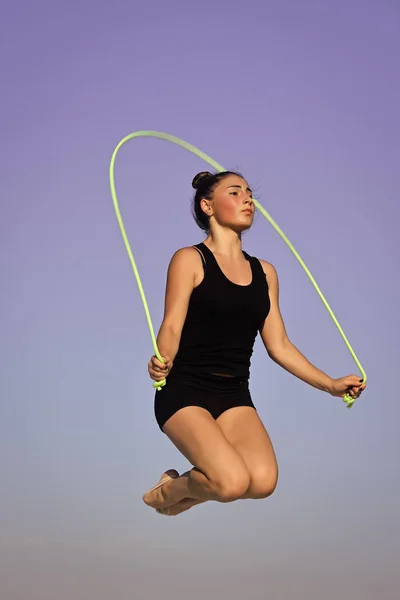 jumping rope. Flexibility in acrobatics and fitness health.