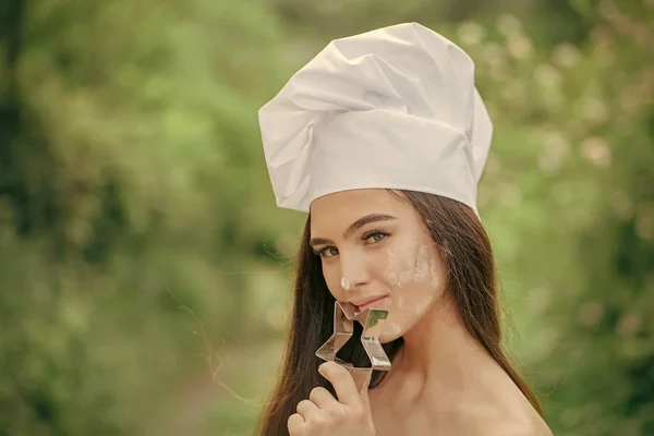 Chef girl. Girl posing with star cookie cutter — Stock Photo, Image