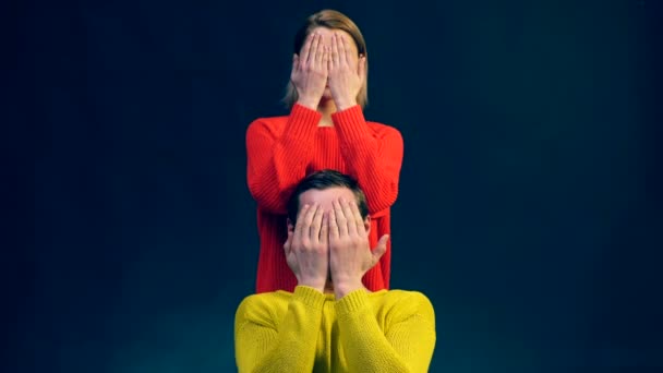 Comedy sketch of mimes. Waist up portrait of man and woman on black background, performing a pantomime show. — Stock Video